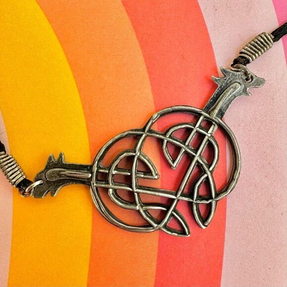 Silver tone double dog knotted pendant necklace - Picture 4 of 8